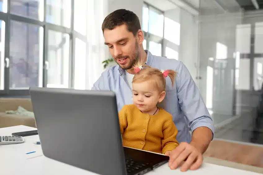 Next Generation Financial Planning - Man and child on laptop